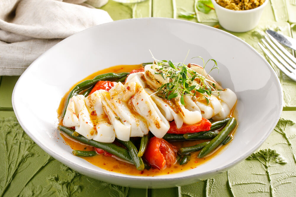 Squid rings on a bed of vegetables