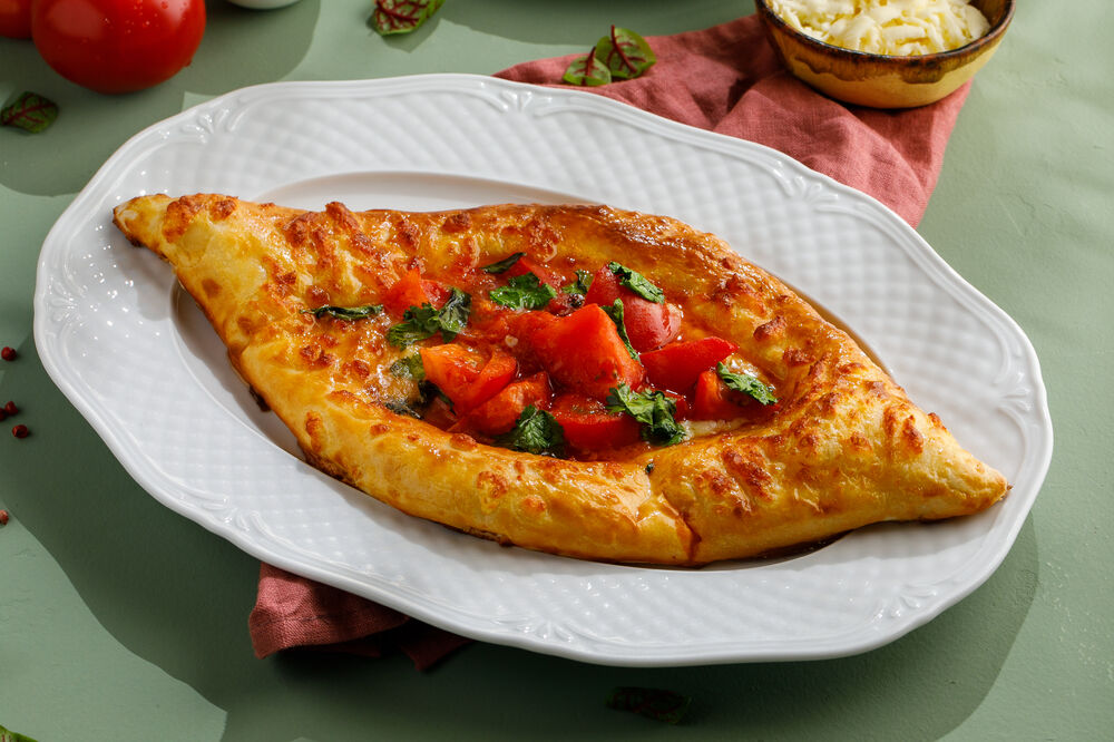 Adjarian khachapuri with tomatoes