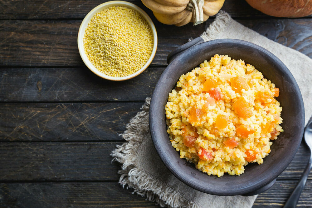 Quinoa porridge on pumpkin with feta cheese