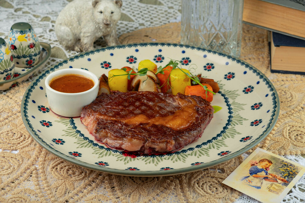 Ribeye steak with baked vegetables