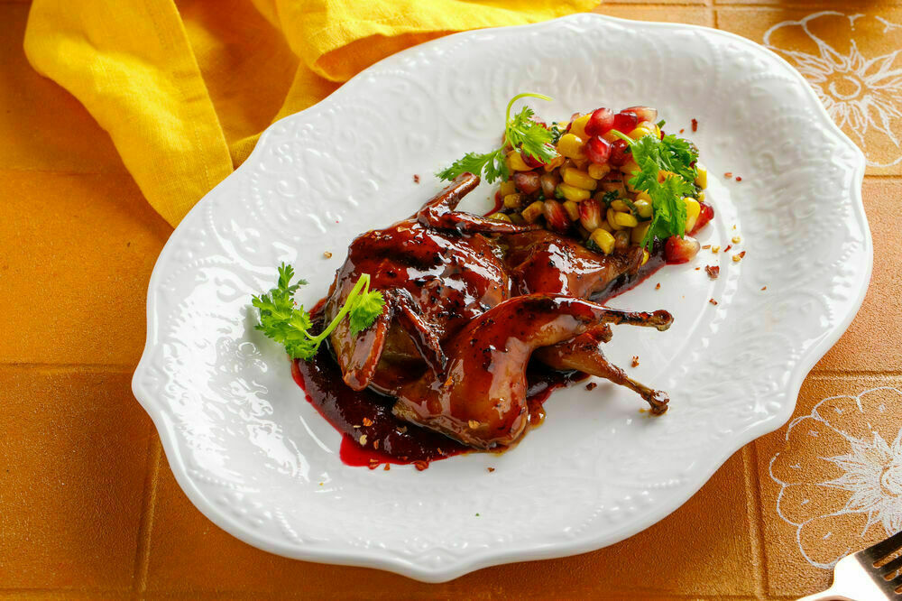 Baked quail with corn and Tkemali