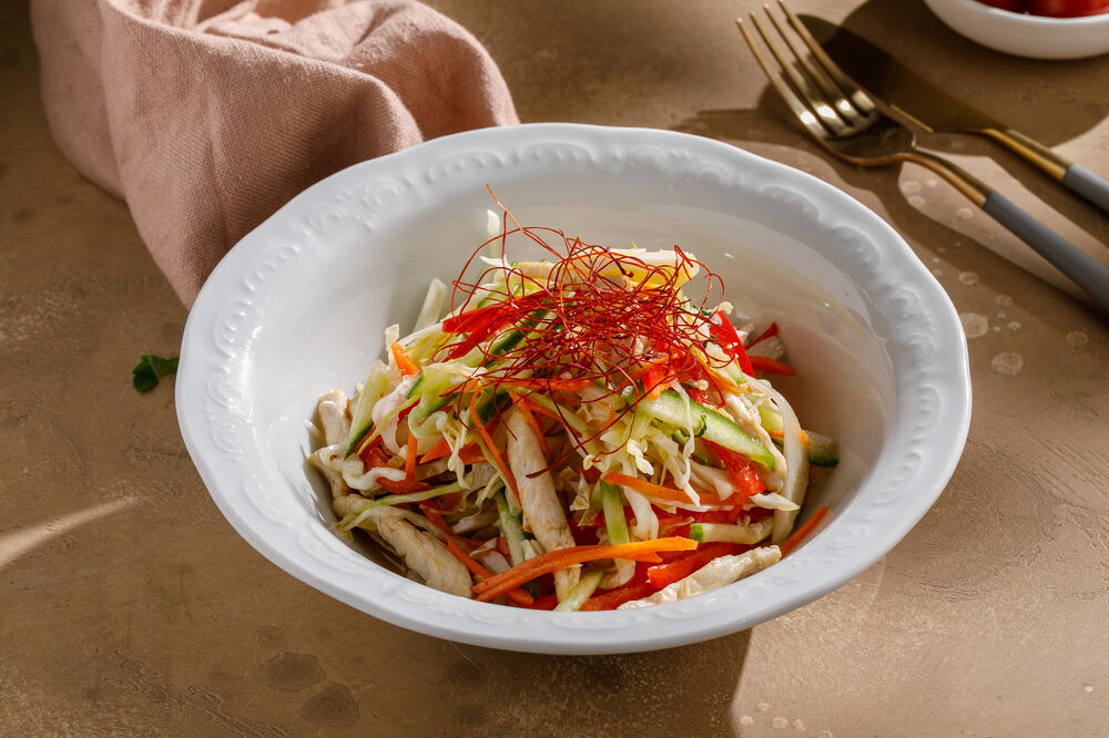 Salad with chicken, cabbage and sesame oil