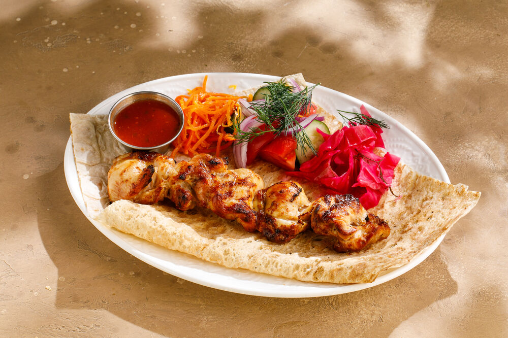 Chicken thigh shashlik on charcoal