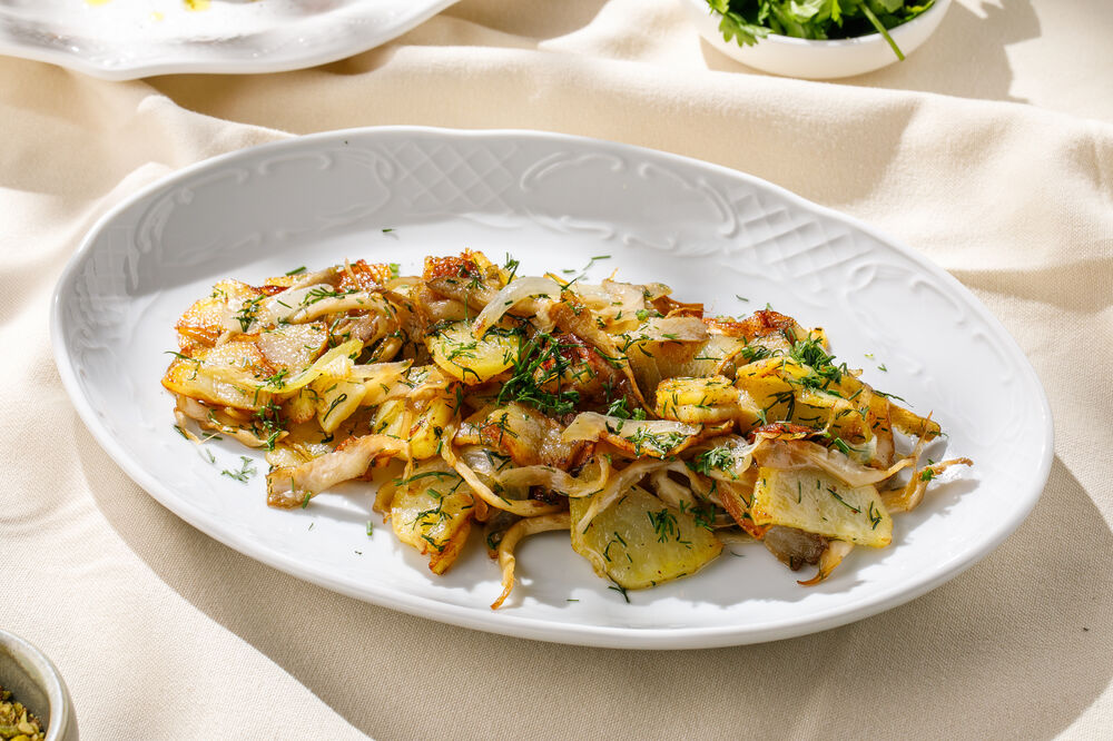 Fried potatoes with mushrooms