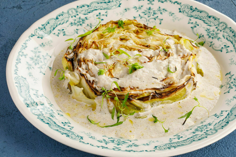 Young cabbage steak with truffle sauce