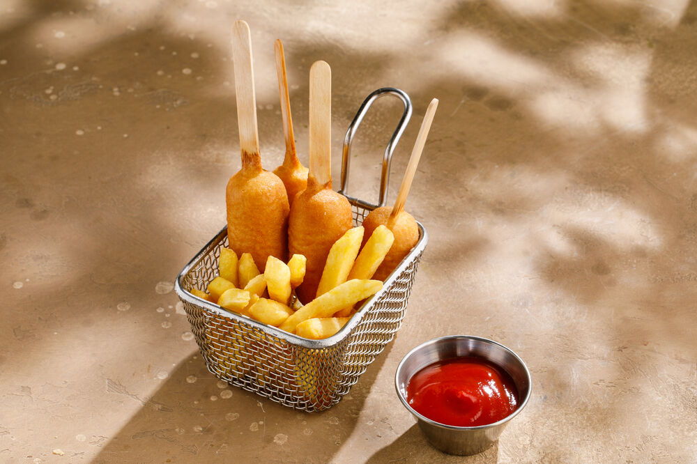 Sausages in dough with French fries