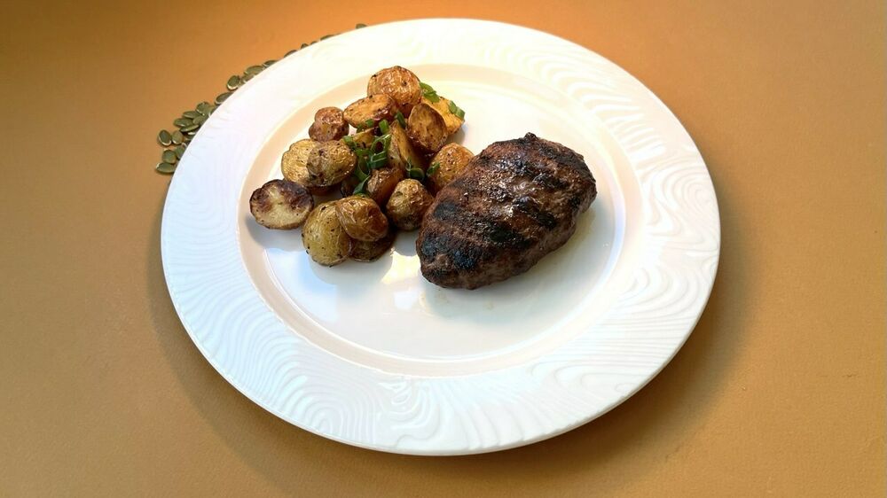 Chopped cutlet with mushrooms and stone potatoes