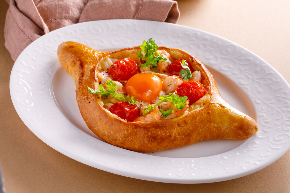 Adjarian khachapuri with seafood