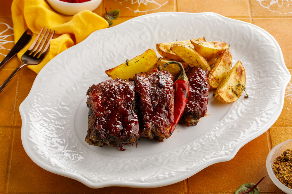 Pork ribs in barbecue sauce with potatoes