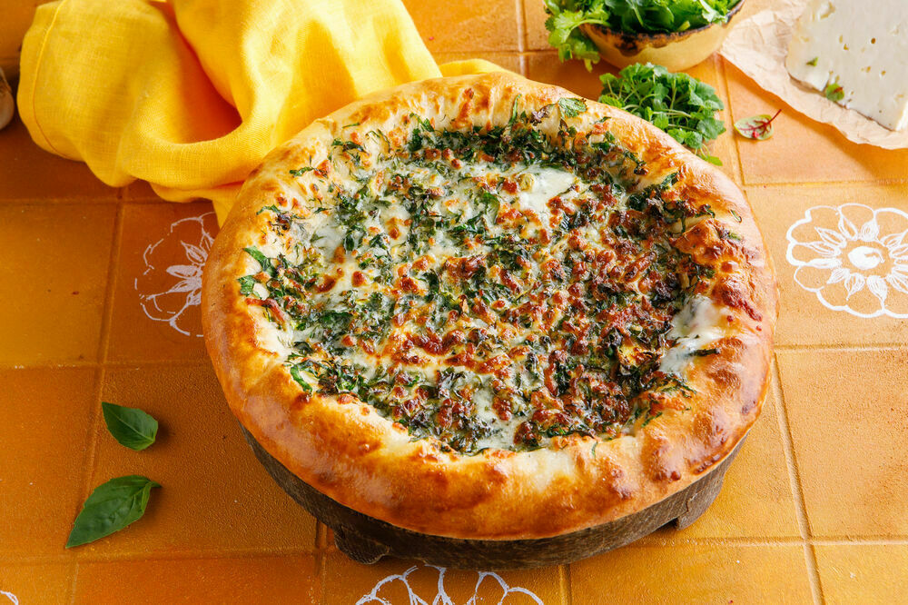 Khachapuri with cheese and herbs