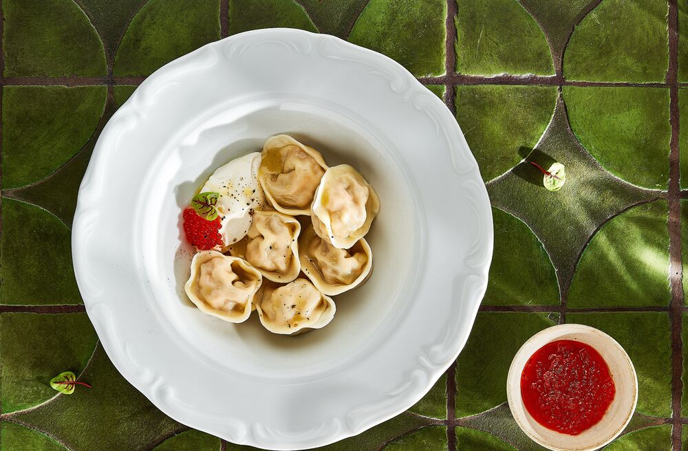 Dumplings with salmon and stewed cabbage