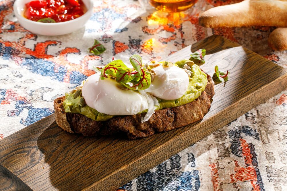 Rye toast with avocado and poached egg