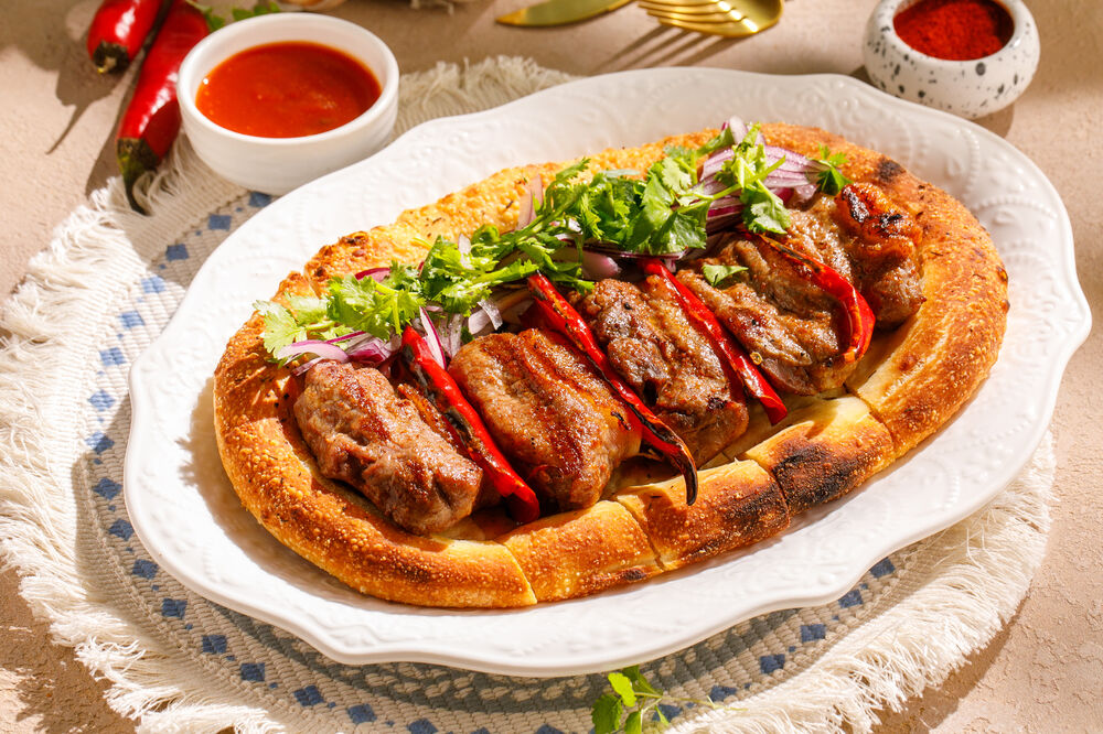 Grilled saddle of lamb on spicy flatbread