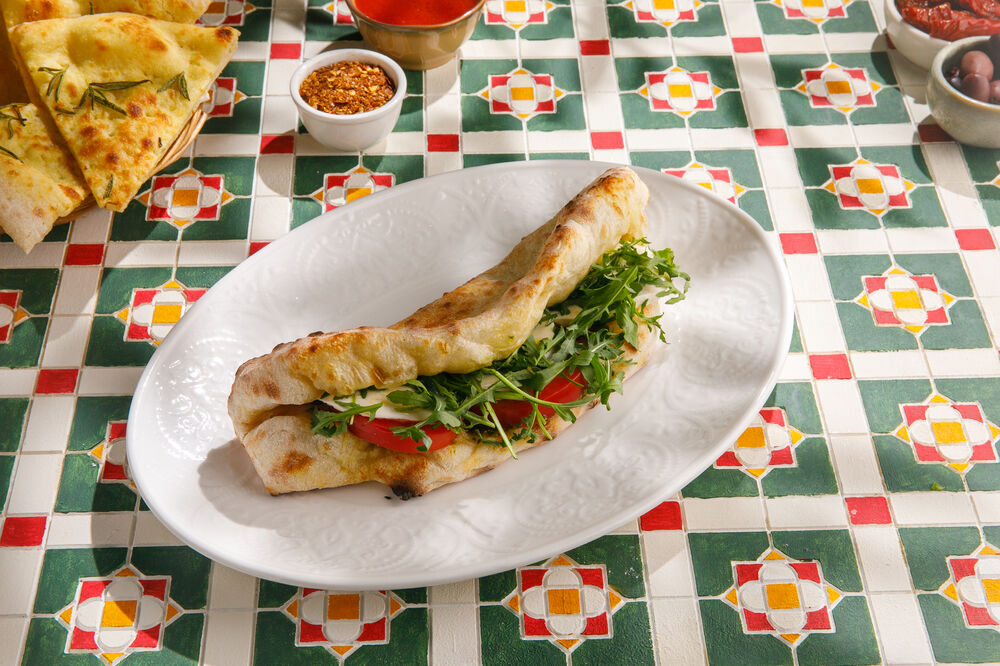 panini with mozzarella buffalo tomatoes and arugula