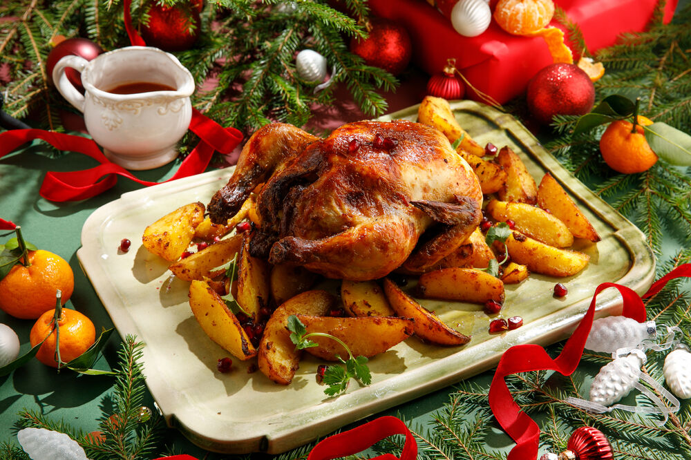Baked chicken with adjika and potatoes