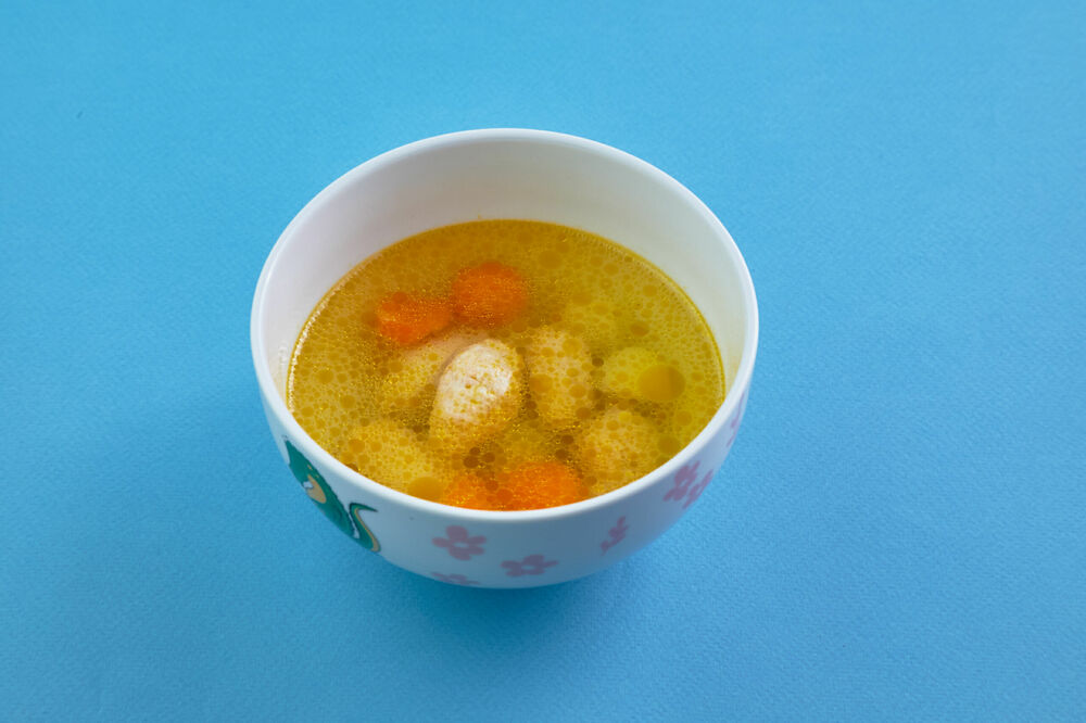 Soup with quenelles of turkey