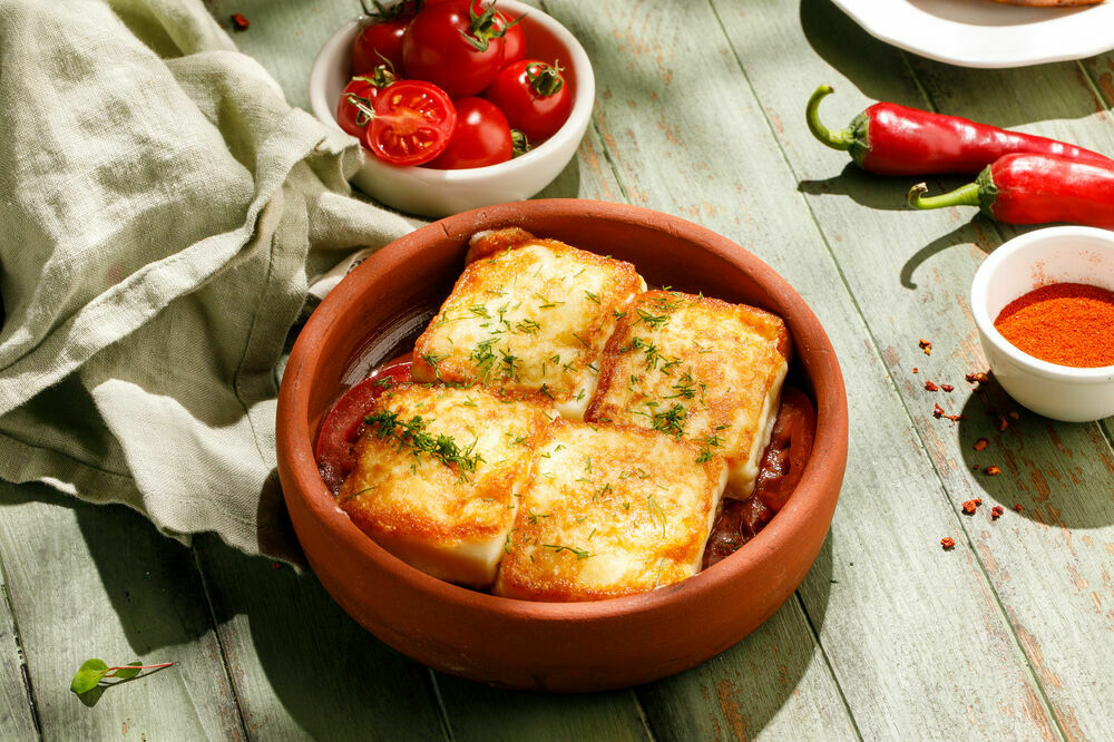 Baked Suluguni cheese with tomatoes