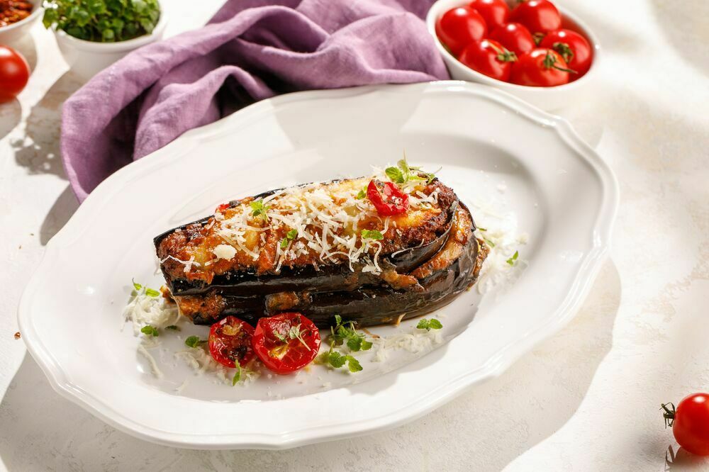 Layered eggplant with meat and smoked sulguni cheese
