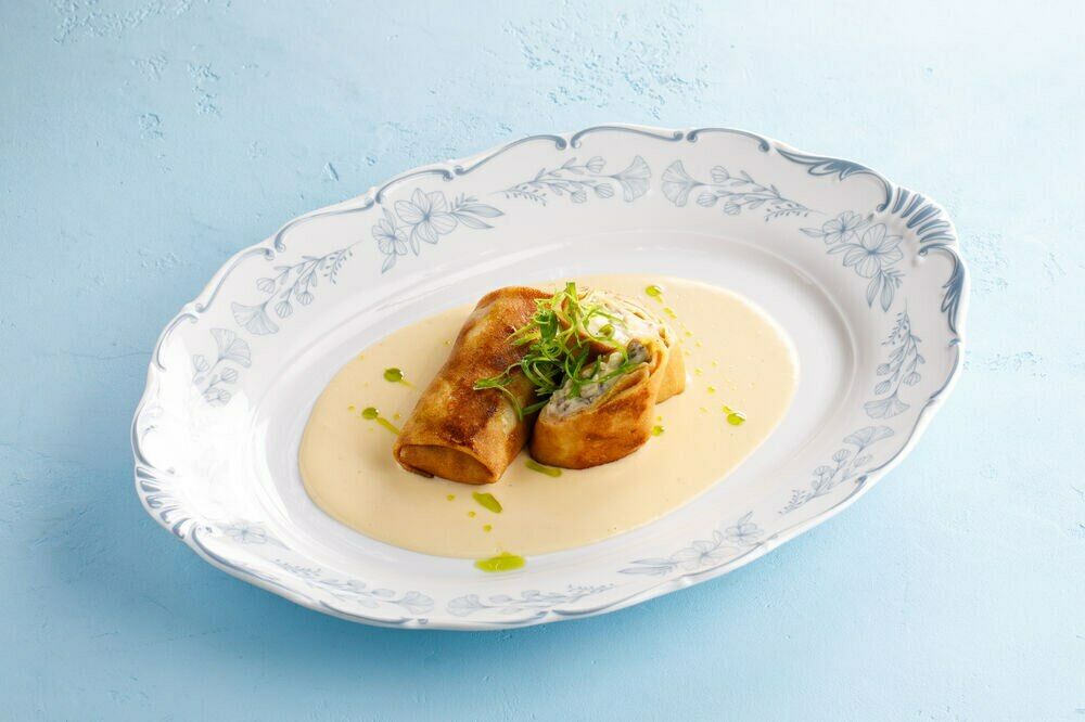 Pancakes with stewed rabbit and black truffle