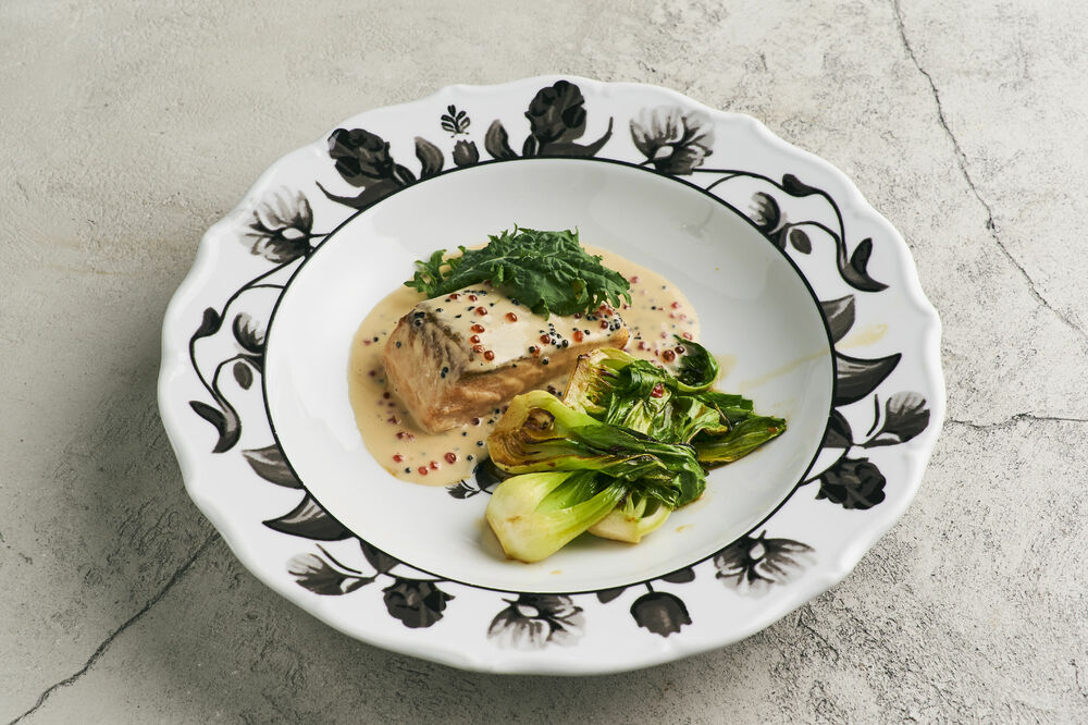 Salmon with caviar sauce and pak cho