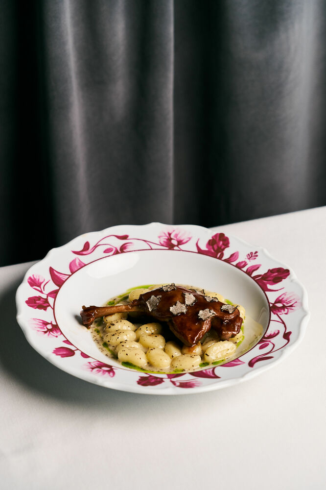 Duck leg confit with potato gnocchi and truffle