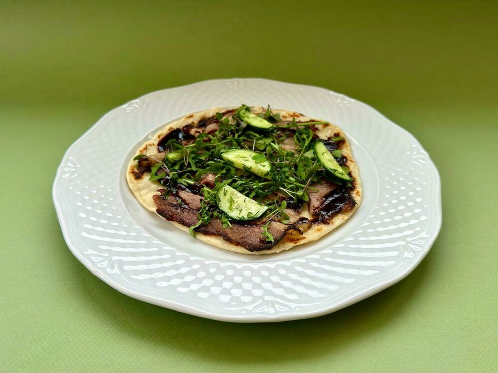 Roti with brisket, crushed cucumbers and Demiglas sauce