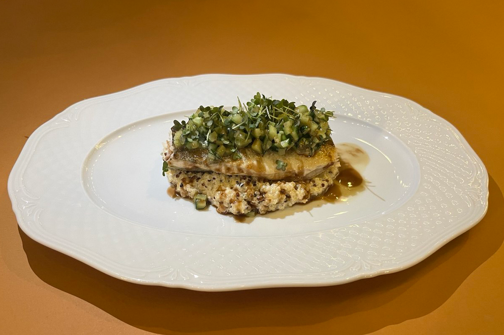 Sea bass with quinoa and pomegranate sauce