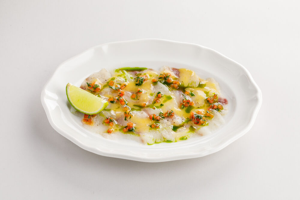 Sea bass carpaccio with mandarin and kaffir lime sauce