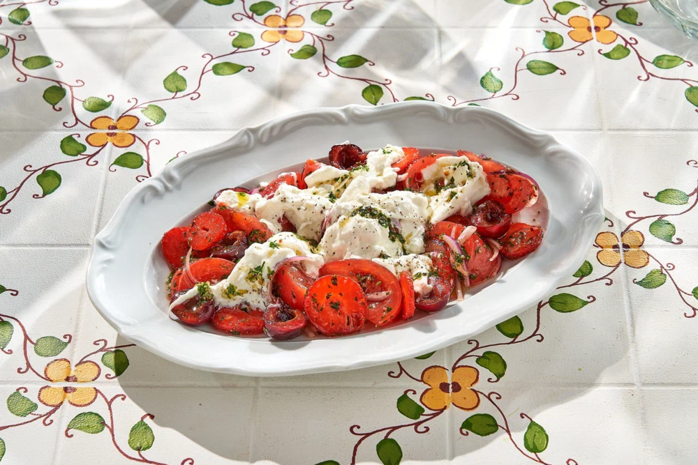 Burrata with cherries and strawberries