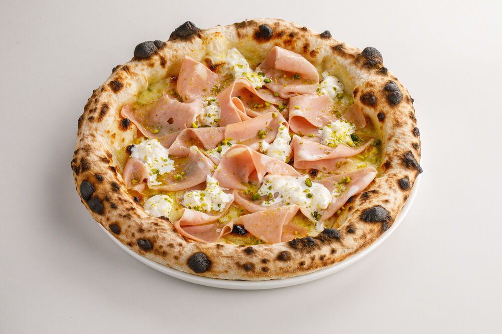 Pizza with mortadella, pistachios and stracciatella