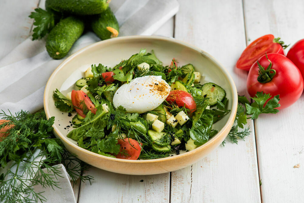 Salad with Caucasian greens and poached egg