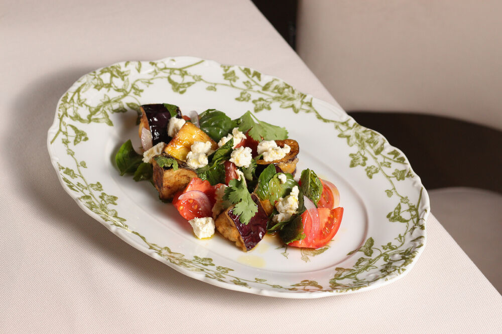 Salad with fried eggplant, tomatoes and smoked feta