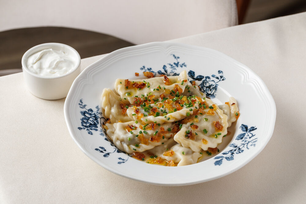 Vareniki with potatoes, mushrooms, and onions