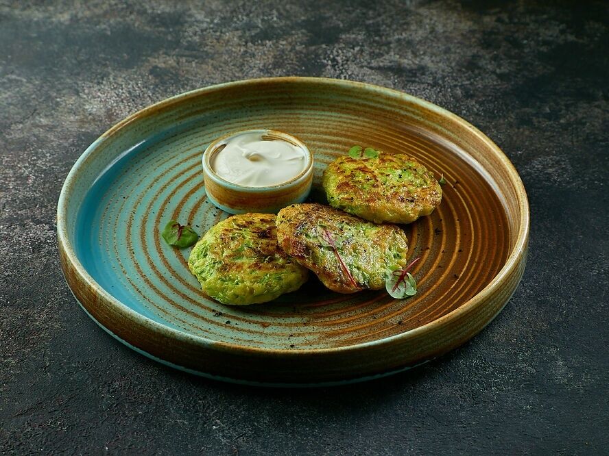 Zucchini pancakes with sour cream