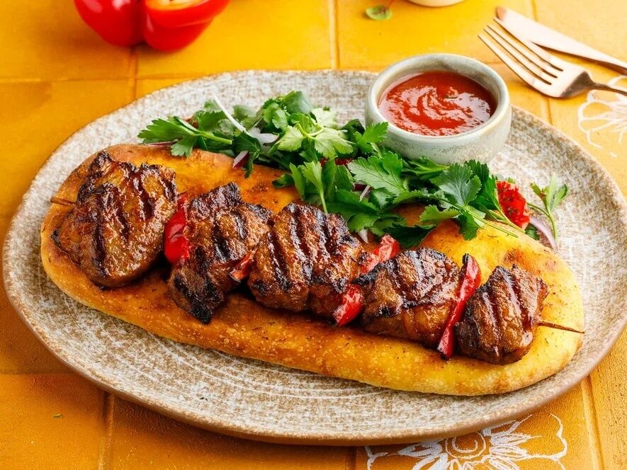 Lamb saddle on a spicy flatbread