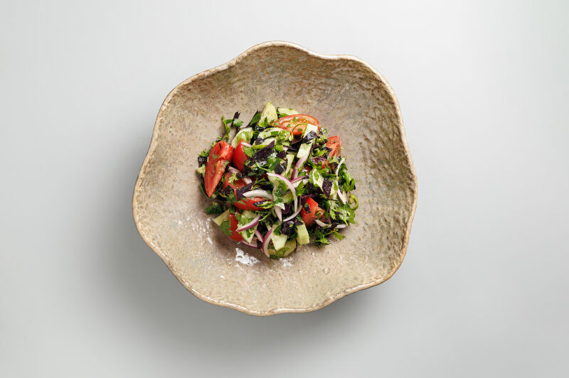 Vegetable salad with spices and Kakhetian oil