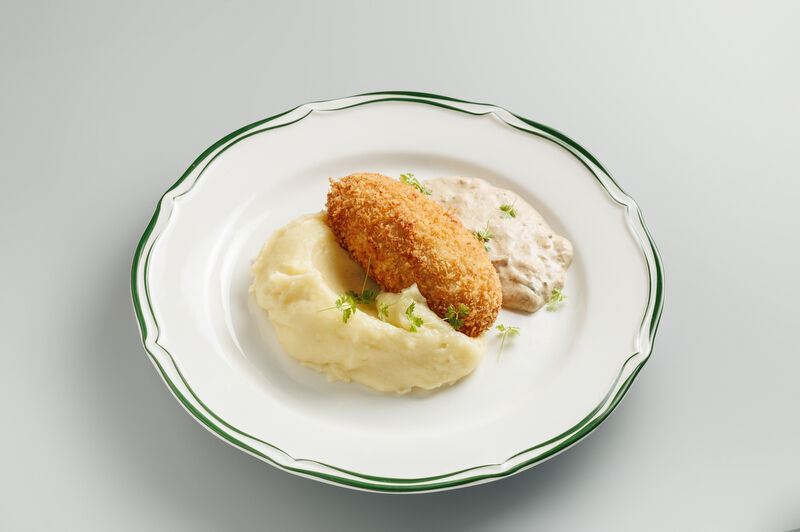 Chicken cutlet with mashed potatoes and mushroom sauce