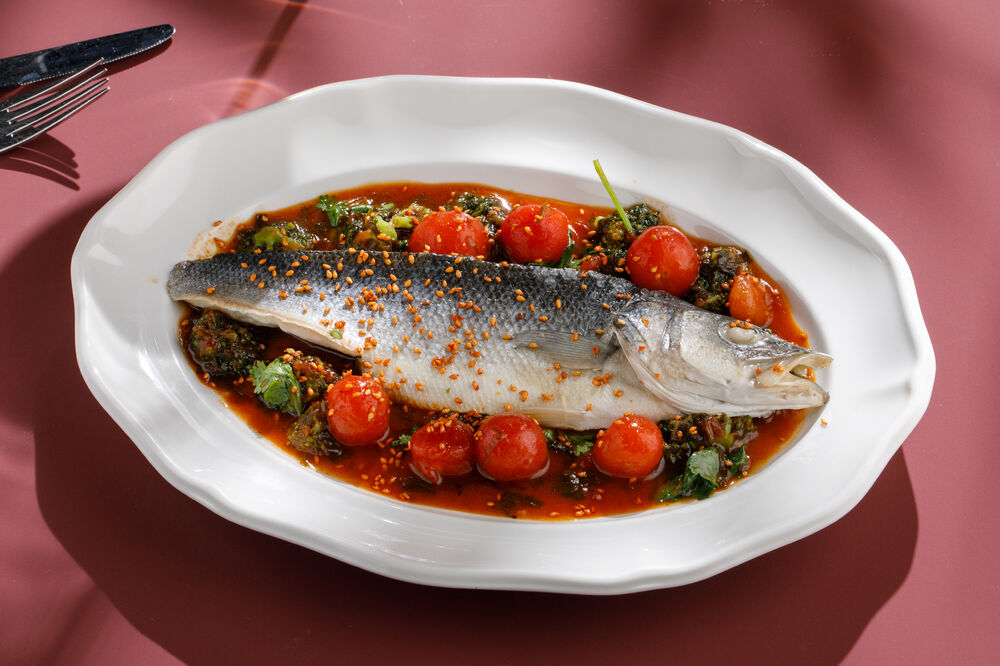 Sea bass fillet steamed with cherry, broccoli and kimchi sauce
