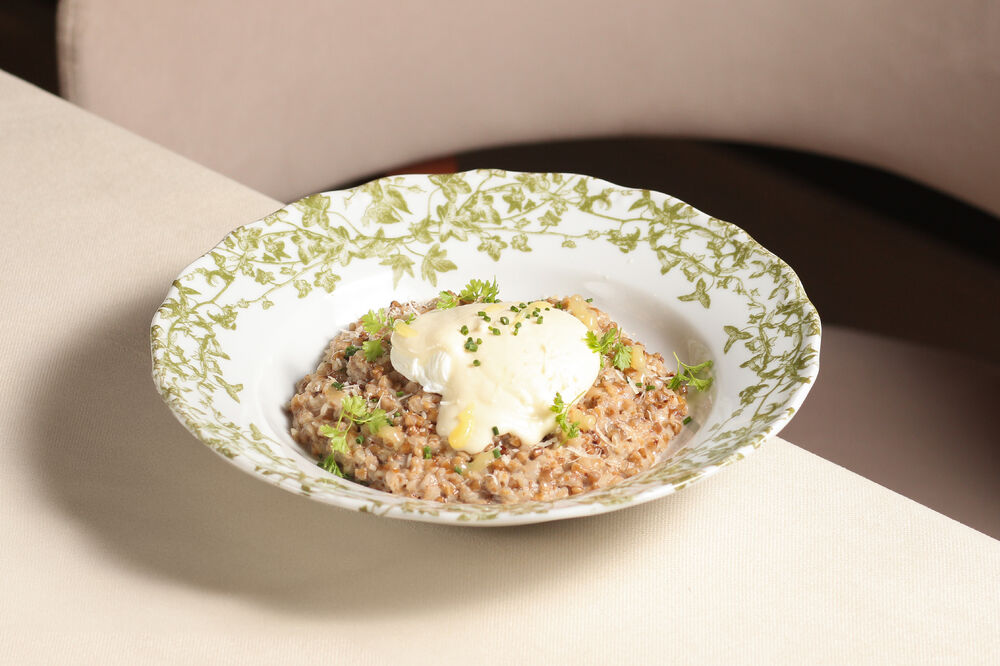 Buckwheat porridge with poached egg and parmesan sauce