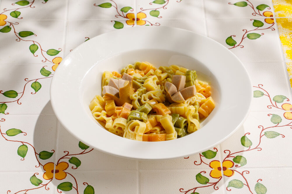 Children's colored pasta with sausages