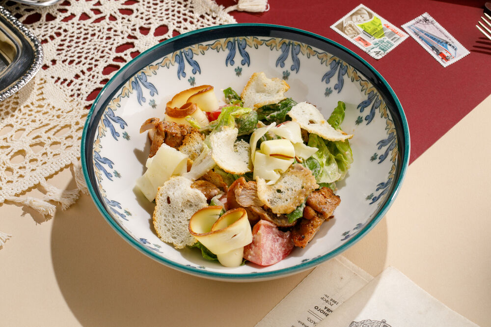 Warm salad with chicken and smoked Suluguni cheese