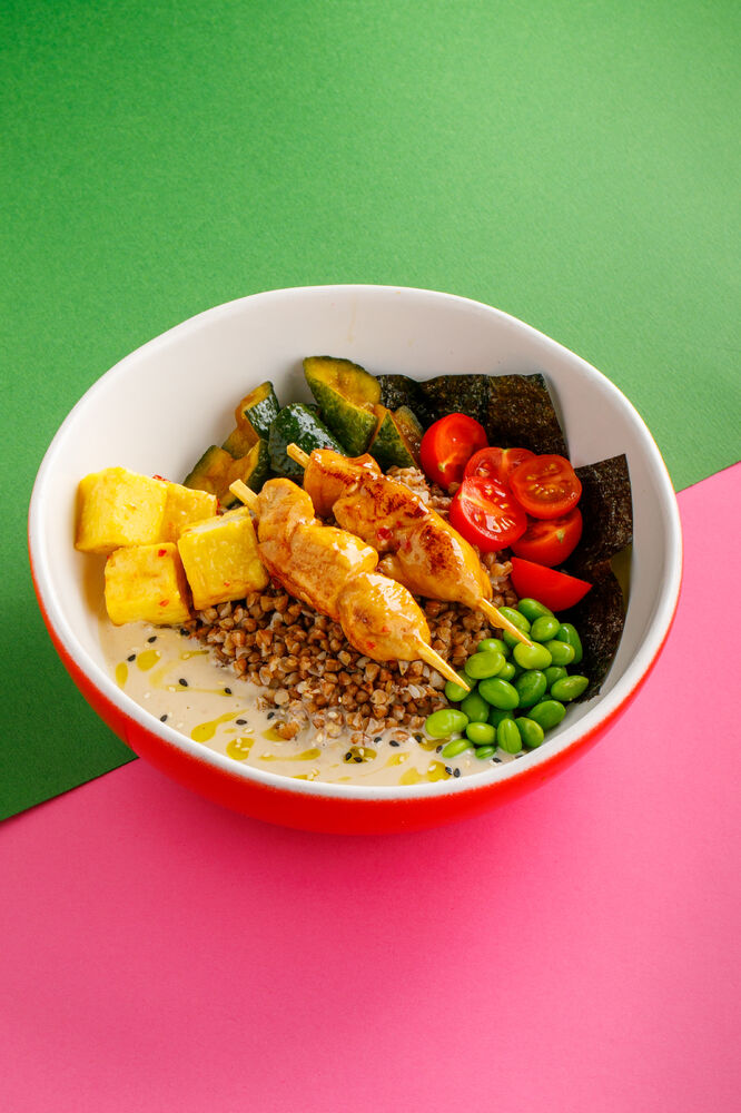 Bowl with buckwheat, tofu, and chicken kebabs.