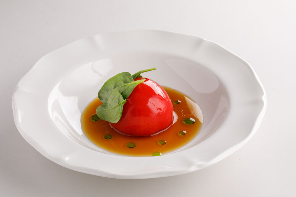 Tomato with crab, stracciatella and tomato water