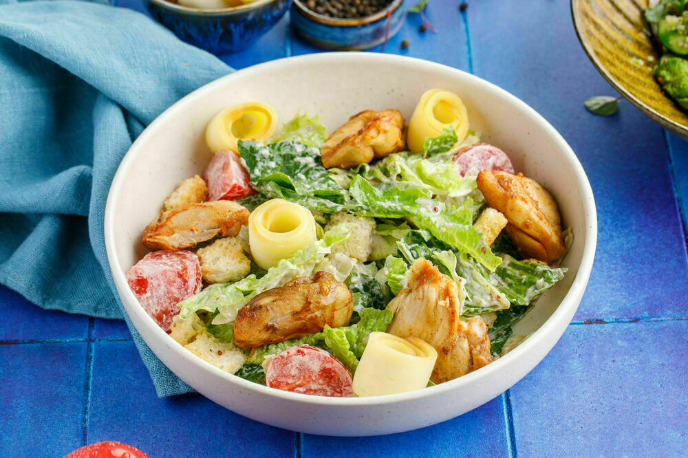 Salad with warm chicken thigh and smoked Suluguni cheese