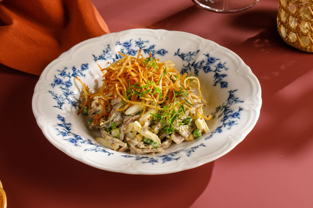 Beef tongue salad with pickled cucumbers