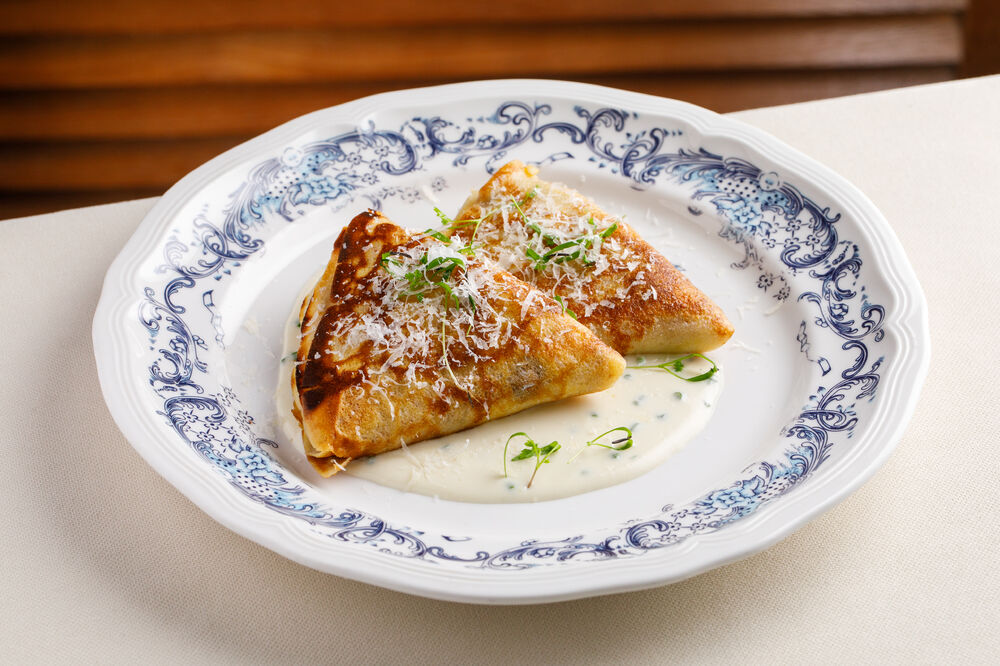 Pancakes with cabbage from the oven with Parmesan sauce