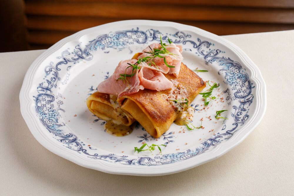 Pancakes with mushroom julienne and tambov ham