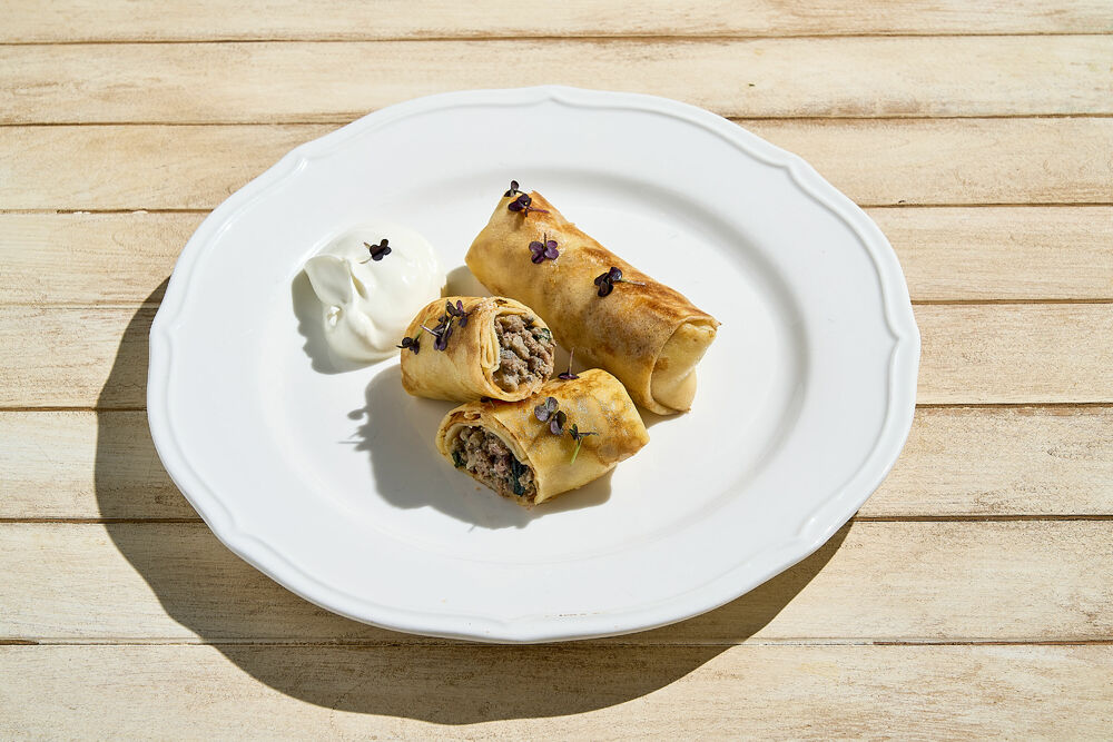 Pancakes with meat, onions and aromatic herbs