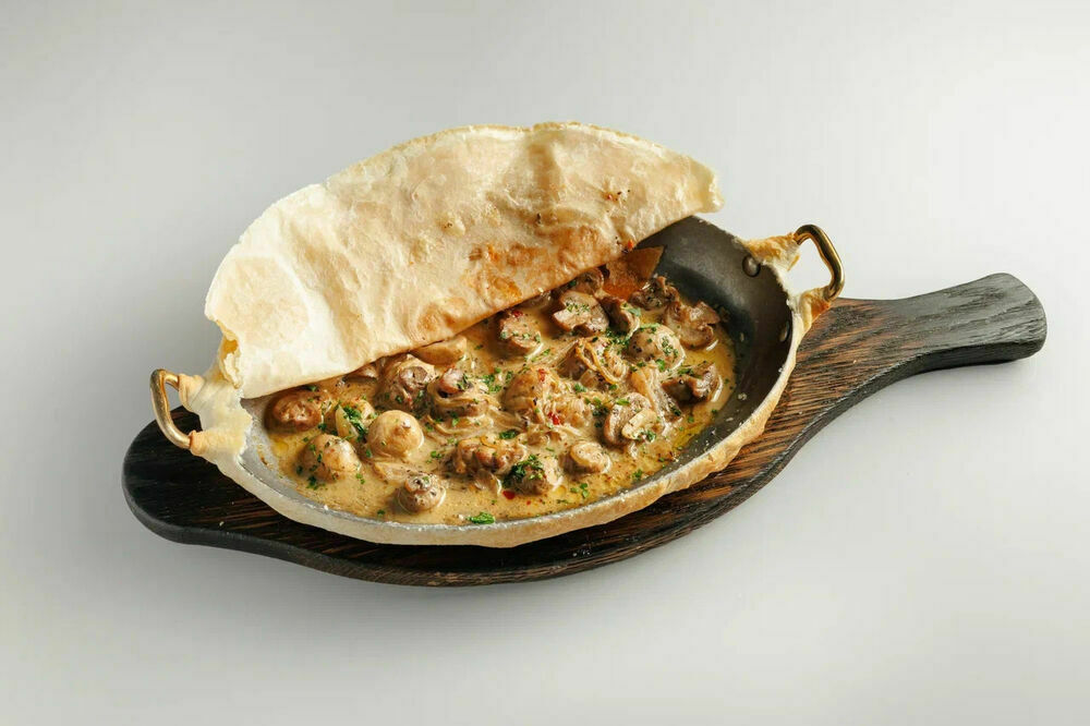 Baked champignons with lecho sauce