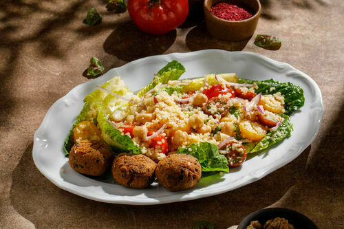 Salad with couscous and falafel